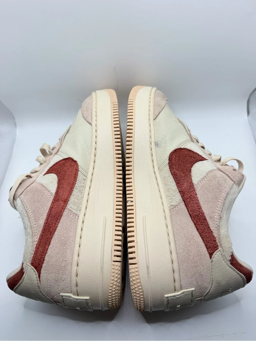 Nike Women's Low-Top Sneakers in Cream with Rust Swoosh
